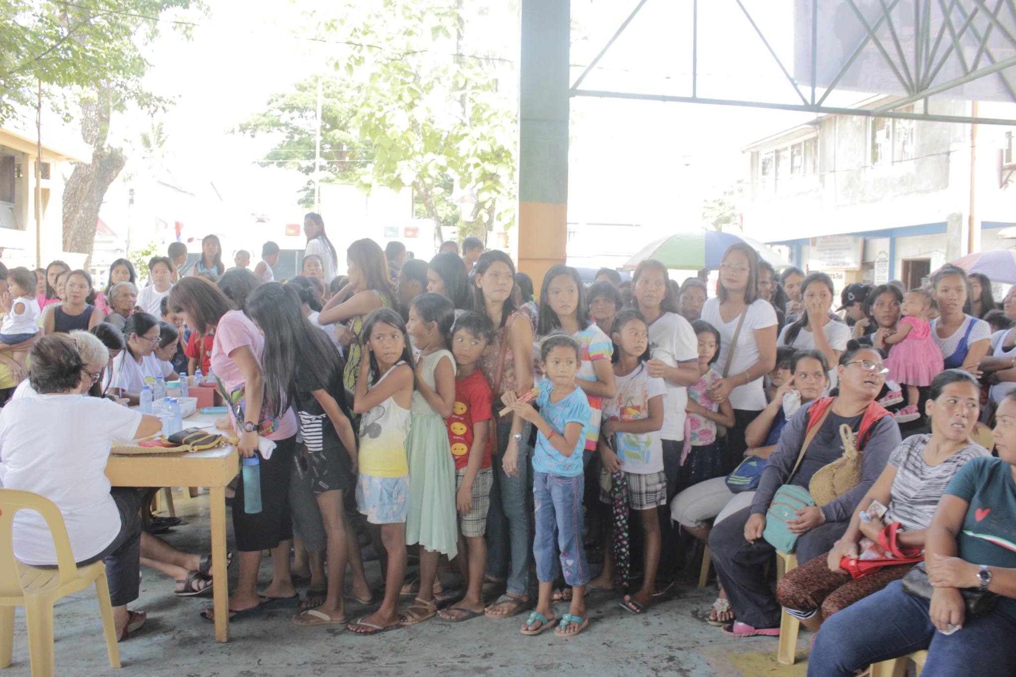 Children and guardians lining up during the distribution